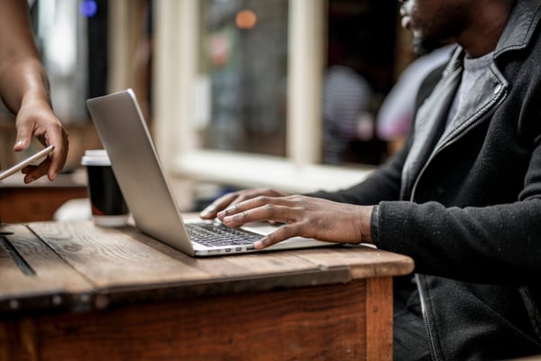 Businessman-working-remotely-from-cafe-2