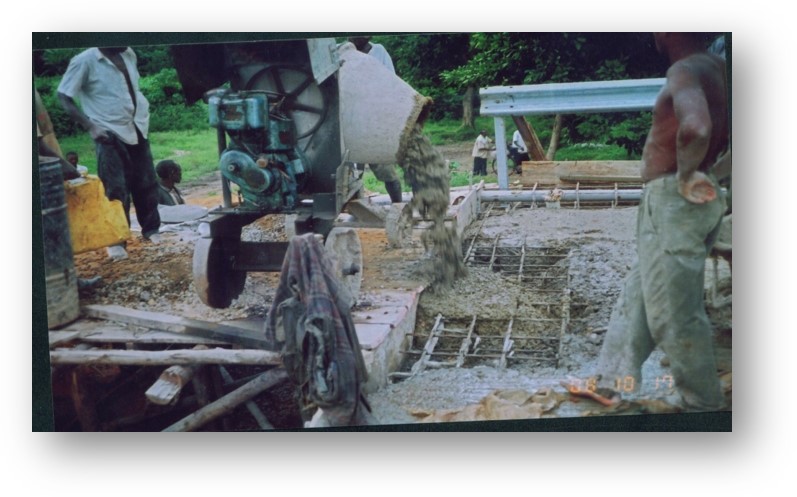 Nexus (U) Limited was entrusted with the construction of the Kanungu Bridge in Kanungu District, Uganda. This infrastructure project aimed to improve transportation, connectivity, and accessibility in the region, supporting economic development and improving the quality of life for local residents. Scope of the Construction Work The construction of Kanungu Bridge involved several key phases, from initial planning and design to final execution, with a focus on ensuring the bridge's structural integrity and longevity. Surveying and Design: The first phase of the project included detailed surveying of the site and designing a bridge structure that could withstand the region's environmental and traffic demands. The design process took into account local topography, hydrology, and soil conditions. Foundation Work: The foundation of the bridge was carefully designed to ensure stability and safety, with deep foundations constructed to support the weight of the bridge and the traffic it would carry. Bridge Deck and Superstructure: The bridge deck and superstructure were constructed using reinforced concrete and steel, materials chosen for their strength and durability. The deck was designed to accommodate vehicular traffic and pedestrian movement safely. Piling and Pier Construction: Strong and reliable piling and piers were built to ensure the bridge’s stability over the water and provide resistance to environmental factors like flooding and erosion. Approach Roads and Pavement: Nexus (U) Limited constructed the approach roads leading to the bridge, ensuring smooth connectivity with existing road networks. Proper paving and road signage were included for safe travel. Safety and Security Features: Safety railings, guardrails, and other protective measures were installed to ensure the safety of drivers and pedestrians. Proper signage and lighting were also added to enhance visibility, especially during the night. Environmental Considerations: Throughout the construction, Nexus (U) Limited implemented environmentally responsible practices, ensuring minimal disruption to local wildlife and ecosystems during the building process. Final Inspection and Testing: After construction was completed, the bridge was thoroughly inspected to ensure compliance with safety and quality standards. Load testing and other necessary assessments were conducted before the official opening. Benefits of the Kanungu Bridge Improved Accessibility: The completion of Kanungu Bridge has greatly improved transportation across the district, reducing travel time and connecting rural communities to nearby towns and cities. Economic Development: The bridge facilitates easier access to markets, services, and resources, benefiting local farmers, businesses, and residents. Enhanced Safety: The new bridge has provided a safer alternative to previous crossing methods, especially during rainy seasons when flooding and erosion were common concerns. Community Connectivity: The bridge plays a crucial role in connecting Kanungu District to other parts of Uganda, promoting regional integration and supporting infrastructure development. Completion and Outcome The Kanungu Bridge was successfully completed, with Nexus (U) Limited ensuring high standards of construction quality, safety, and environmental sustainability. The bridge now stands as a vital infrastructure asset, providing lasting benefits to the local community and supporting the broader development objectives of the region.