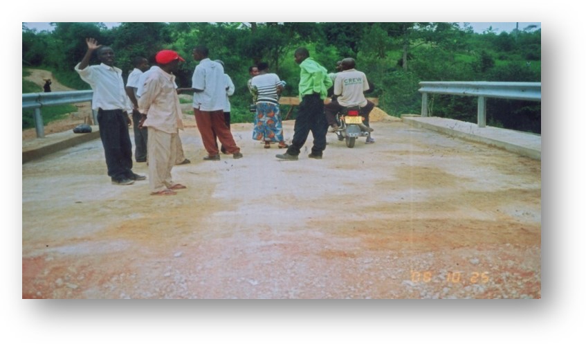 Nexus (U) Limited was entrusted with the construction of the Kanungu Bridge in Kanungu District, Uganda. This infrastructure project aimed to improve transportation, connectivity, and accessibility in the region, supporting economic development and improving the quality of life for local residents. Scope of the Construction Work The construction of Kanungu Bridge involved several key phases, from initial planning and design to final execution, with a focus on ensuring the bridge's structural integrity and longevity. Surveying and Design: The first phase of the project included detailed surveying of the site and designing a bridge structure that could withstand the region's environmental and traffic demands. The design process took into account local topography, hydrology, and soil conditions. Foundation Work: The foundation of the bridge was carefully designed to ensure stability and safety, with deep foundations constructed to support the weight of the bridge and the traffic it would carry. Bridge Deck and Superstructure: The bridge deck and superstructure were constructed using reinforced concrete and steel, materials chosen for their strength and durability. The deck was designed to accommodate vehicular traffic and pedestrian movement safely. Piling and Pier Construction: Strong and reliable piling and piers were built to ensure the bridge’s stability over the water and provide resistance to environmental factors like flooding and erosion. Approach Roads and Pavement: Nexus (U) Limited constructed the approach roads leading to the bridge, ensuring smooth connectivity with existing road networks. Proper paving and road signage were included for safe travel. Safety and Security Features: Safety railings, guardrails, and other protective measures were installed to ensure the safety of drivers and pedestrians. Proper signage and lighting were also added to enhance visibility, especially during the night. Environmental Considerations: Throughout the construction, Nexus (U) Limited implemented environmentally responsible practices, ensuring minimal disruption to local wildlife and ecosystems during the building process. Final Inspection and Testing: After construction was completed, the bridge was thoroughly inspected to ensure compliance with safety and quality standards. Load testing and other necessary assessments were conducted before the official opening. Benefits of the Kanungu Bridge Improved Accessibility: The completion of Kanungu Bridge has greatly improved transportation across the district, reducing travel time and connecting rural communities to nearby towns and cities. Economic Development: The bridge facilitates easier access to markets, services, and resources, benefiting local farmers, businesses, and residents. Enhanced Safety: The new bridge has provided a safer alternative to previous crossing methods, especially during rainy seasons when flooding and erosion were common concerns. Community Connectivity: The bridge plays a crucial role in connecting Kanungu District to other parts of Uganda, promoting regional integration and supporting infrastructure development. Completion and Outcome The Kanungu Bridge was successfully completed, with Nexus (U) Limited ensuring high standards of construction quality, safety, and environmental sustainability. The bridge now stands as a vital infrastructure asset, providing lasting benefits to the local community and supporting the broader development objectives of the region.