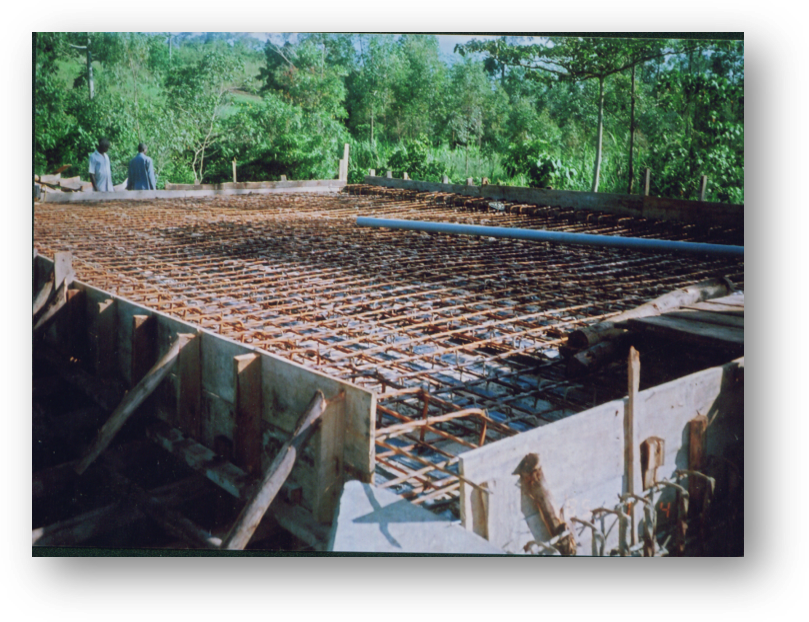 Nexus (U) Limited was entrusted with the construction of the Kanungu Bridge in Kanungu District, Uganda. This infrastructure project aimed to improve transportation, connectivity, and accessibility in the region, supporting economic development and improving the quality of life for local residents. Scope of the Construction Work The construction of Kanungu Bridge involved several key phases, from initial planning and design to final execution, with a focus on ensuring the bridge's structural integrity and longevity. Surveying and Design: The first phase of the project included detailed surveying of the site and designing a bridge structure that could withstand the region's environmental and traffic demands. The design process took into account local topography, hydrology, and soil conditions. Foundation Work: The foundation of the bridge was carefully designed to ensure stability and safety, with deep foundations constructed to support the weight of the bridge and the traffic it would carry. Bridge Deck and Superstructure: The bridge deck and superstructure were constructed using reinforced concrete and steel, materials chosen for their strength and durability. The deck was designed to accommodate vehicular traffic and pedestrian movement safely. Piling and Pier Construction: Strong and reliable piling and piers were built to ensure the bridge’s stability over the water and provide resistance to environmental factors like flooding and erosion. Approach Roads and Pavement: Nexus (U) Limited constructed the approach roads leading to the bridge, ensuring smooth connectivity with existing road networks. Proper paving and road signage were included for safe travel. Safety and Security Features: Safety railings, guardrails, and other protective measures were installed to ensure the safety of drivers and pedestrians. Proper signage and lighting were also added to enhance visibility, especially during the night. Environmental Considerations: Throughout the construction, Nexus (U) Limited implemented environmentally responsible practices, ensuring minimal disruption to local wildlife and ecosystems during the building process. Final Inspection and Testing: After construction was completed, the bridge was thoroughly inspected to ensure compliance with safety and quality standards. Load testing and other necessary assessments were conducted before the official opening. Benefits of the Kanungu Bridge Improved Accessibility: The completion of Kanungu Bridge has greatly improved transportation across the district, reducing travel time and connecting rural communities to nearby towns and cities. Economic Development: The bridge facilitates easier access to markets, services, and resources, benefiting local farmers, businesses, and residents. Enhanced Safety: The new bridge has provided a safer alternative to previous crossing methods, especially during rainy seasons when flooding and erosion were common concerns. Community Connectivity: The bridge plays a crucial role in connecting Kanungu District to other parts of Uganda, promoting regional integration and supporting infrastructure development. Completion and Outcome The Kanungu Bridge was successfully completed, with Nexus (U) Limited ensuring high standards of construction quality, safety, and environmental sustainability. The bridge now stands as a vital infrastructure asset, providing lasting benefits to the local community and supporting the broader development objectives of the region.